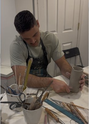 Pottery student working with clay at Artworks in Potomac, MD